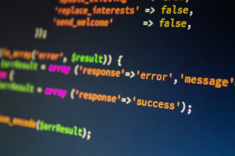 A close-up photograph of a computer screen displaying software code with various lines of syntax highlighted in different colors. The code includes words such as 'false', 'error', 'message', and 'succ